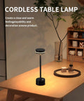 Black Go To Cordless Battery Powered LED Desk Lamp With Touch Control on a wooden table, illuminating a cozy living room.