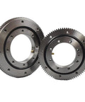 Top Tier Ball Slewing Ring Bearing With External Gears And Four Point Contact For Smooth As Butter Turntable Rotation Built Like A Tank For Job Site Heavy Machinery 011450, showing two durable steel gears.