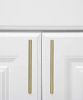 Gold Champagne Euro Bar Cabinet Handles 7 And 3 Eighths Inch Long 5 Inch Hole Center One Half Inch Diameter on white cabinets