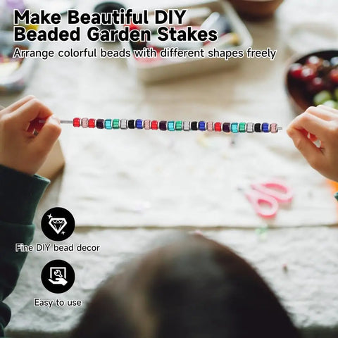 Child threading beads on rod from Beaded Garden Stake Craft Kit With 24 Stainless Steel Threaded Rods 12 Inch Long 8 32 Thread Includes Nuts