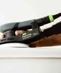 Topshelf Random Orbit Sander With Stepless Speed Control delivering smooth finishes on a wooden surface during refinishing.