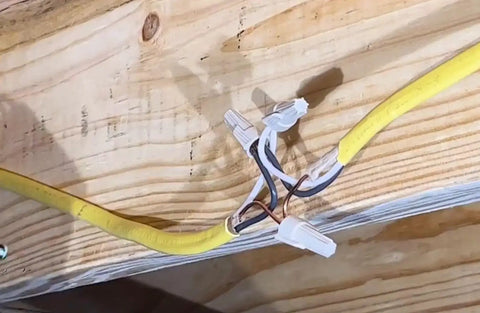 Open Splice Junction Box Single UL Listed Easy Five Second Installation Splice Box For Electrical Wiring 25.8 Cu In Capacity Four Sided Wiring Access USA Made Fire Resistant Polymer JB400 installed in wooden ceiling with wiring connections visible