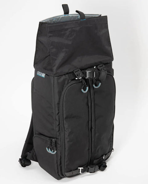 City Commuter Camera Backpack With 18 Liter Rolltop Closure, Dedicated Mirrorless Camera Rear Compartment, Padded Laptop And Tablet Sleeves, Rugged Black Urban Carry For Daily Commutes in side view showing closure design.