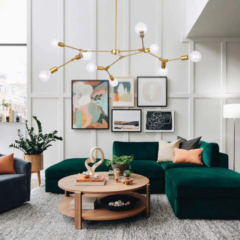 Gold 9 Light Sputnik Chandelier Modern Metal Ceiling Hanging Light Adjustable Pendant Fixture in living room with green sofa.