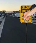 Slow Down Kids At Play Safety Signs In Yellow And Black Reflective Aluminum 14 By 10 Inches installed in residential area