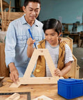 Father and son using Top Shelf Silicone Glue Brush Kit Four Piece Woodworking Applicator Set With Airtight Jar and Fine Chiseled Tapered Bristles.