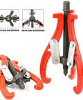 Bad Boy Heavy Duty Three Jaw Puller Yanking Stubborn Gears And Bearings Without Breaking A Sweat Thickened High Carbon Steel tool with red arms.