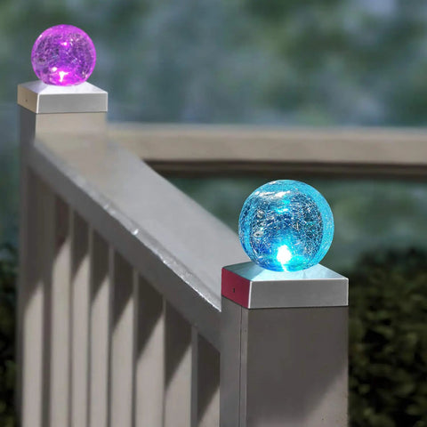 Color-changing 4x4 Solar Post Cap Lights with crackle glass on deck railing, showcasing blue and pink LED, weatherproof design.