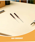15 Piece Straight Cone Awl Set with Durable Wooden Handle for Leathercraft Sewing and Woodworking Hole Punch Projects on a table.