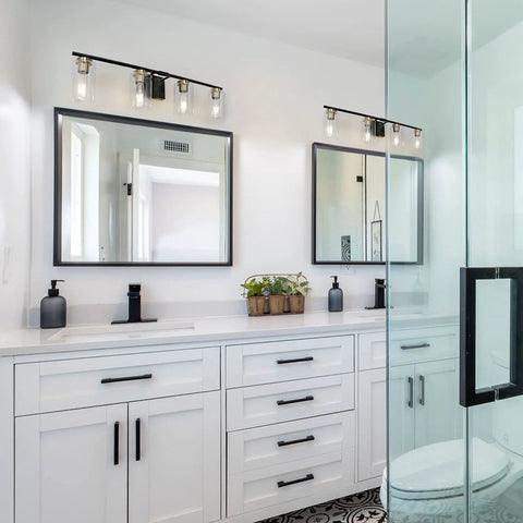 4 Light Bathroom Vanity Light Fixture Modern Black And Gold Sconce Wall Lights Over Mirror With Clear Glass Shades For Powder Room Hallway Easy Install Design That Fits Farmhouse To Mid Century Modern Decor, installed above double mirrors in a modern bathroom.