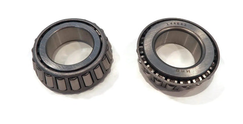 Close-up of two metal bearings from Trailer Axle Kit Assembly With Four On Four Inch Bolt Idler Hub And One Quarter Inch Round BT8 Spindle