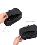 Open black nylon scuba diving storage pocket with double ended hook for sidemount gear, showing main and sub pockets with D-rings.
