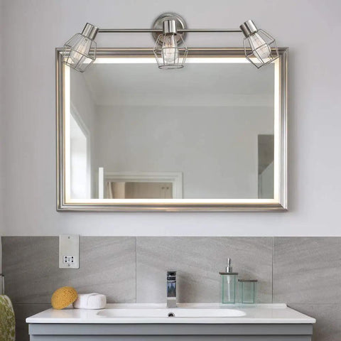 Cedrick 3 Light Track Lighting In Brushed Nickel, Adjustable Heads, installed above a bathroom mirror for focused ambiance lighting