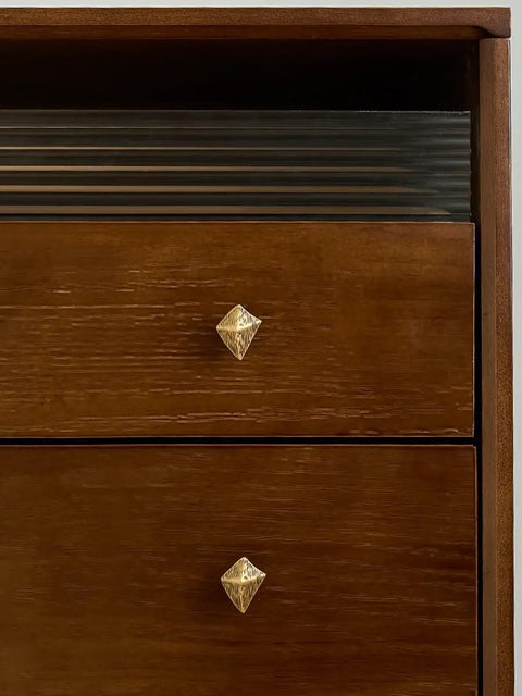 Antique Bronze Cabinet Knobs And Drawer Pulls Two Pack With Boho Geometric Silhouettes on a wooden dresser.