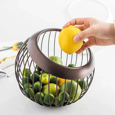 Hand grabbing lemon from wire basket filled with limes, similar to Large Capacity K Cup Pod Holder For Countertop Coffee Bar Accessories