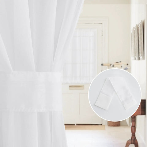 Close-up of Two Panel Sheer Voile French Door Curtains with Light Filtering, shown with tiebacks, 26x72 inches, white, in rustic decor.