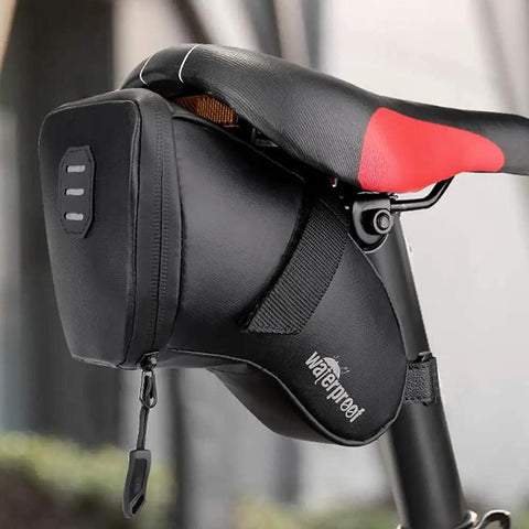 Close-up of waterproof saddle bag from Bike Tire Repair Kit With Waterproof Saddle Bag On The Go attached under a bicycle seat.