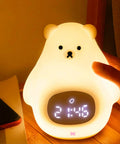 Soft BPA-Free silicone bear night light glowing on bedside table with digital clock display for kids' bedrooms and nurseries