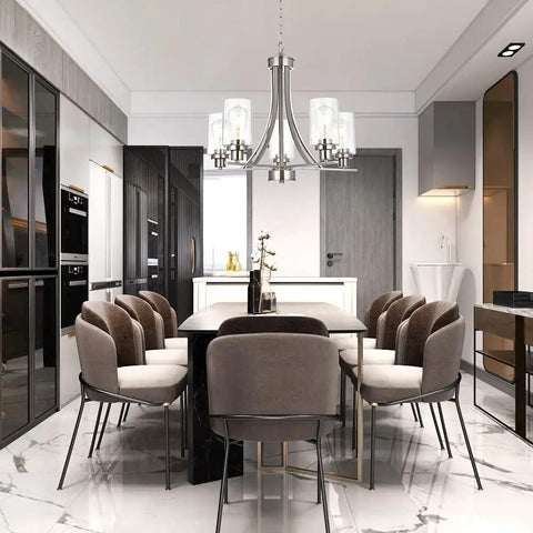 Traditional 5 Light Chandelier In Brushed Nickel With Clear Glass Shades hanging over a modern dining table and chairs