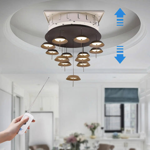 Heavy Duty Chandelier Lifter Hoist Electric 16 Foot 110 Volt Remote Control Raising 220 Lbs Steel Wire Fixture Elevator For Large Lighting in use with remote control.