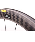 Close-up of Ultralight Carbon Fiber Road Bike Wheelset With Ceramic Bearings And V Brake, zigzag pattern rim design
