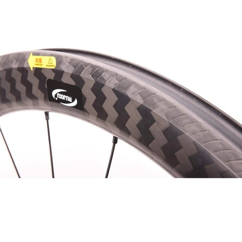 Close-up of Ultralight Carbon Fiber Road Bike Wheelset With Ceramic Bearings And V Brake, zigzag pattern rim design