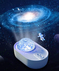 3 In 1 Starry Night Projector with Ocean Wave Nebula Effects showing galaxy projection and astronaut figurine in space theme