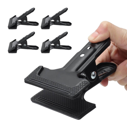 Set Of 4 Heavy Duty Wide Mouth Metal Spring Clamps For Woodworking And Diy Projects Great For Photography Backdrops Bonding Panels Hanging Fabric Papers And Small Fixtures Built From High Hardness Carbon Steel shown in hand and separately.