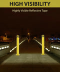 Built Tough Heavy Duty Steel Safety Bollard Post delivering high visibility parking protection with reflective tape on a dimly lit bridge.