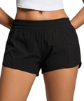 Front view of women's running shorts with built-in liner, quick dry mesh, zip pocket, low rise fit, breathable black fabric.