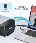 Dual Bay Hard Drive RAID Enclosure With Blazing Fast USB 3.1 10Gbps Speed connected to laptop, showcasing cooling fan design.