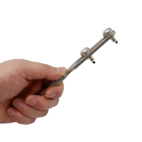 Hand holding Easy Watch Back Remover Tool With Adjustable Wrench For Threaded Notched Back Covers Ideal For Quick Battery Swaps