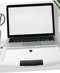Slick Slide Out Under Desk Keyboard Tray With Heavy Duty Clamp Mount on white desk beside laptop, ensuring ergonomic use.