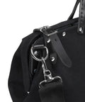 Close-up of Deluxe 16 Inch Canvas Tool Bag With 13 Pockets And Detachable Shoulder Strap showing black leather handle and metal clasp.