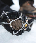 Grippy Ice Cleats For Boots And Shoes With Stainless Steel Micro Spikes, Snow Traction Grips For Hiking Fishing Walking Climbing Mountaineering, 24 Spikes XL Size, Anti Slip Crampons attached to boot on ice