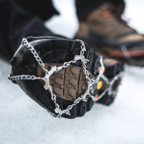 Grippy Ice Cleats For Boots And Shoes With Stainless Steel Micro Spikes, Snow Traction Grips For Hiking Fishing Walking Climbing Mountaineering, 24 Spikes XL Size, Anti Slip Crampons attached to boot on ice
