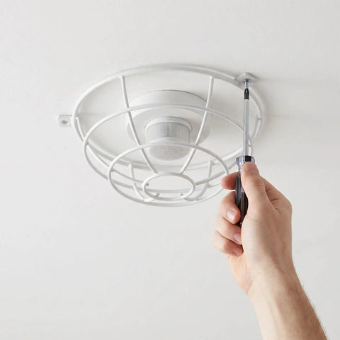 Hand installing Lockdown Fire Sprinkler Head Guard Cover Badass Heavy Duty Stainless Steel Protector Cage 7 X 2.6 Inch.