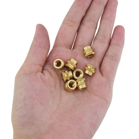 M6 Heat-Set Threaded Inserts Kit, 50 Pcs Brass Knurled Inserts For 3D Printing And Plastic Parts held in hand