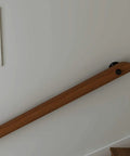 Heavy Duty Wall Mount Stair Railing Handrail Kit For Modern Lofts And Homes Durable Stainless Steel Safety Rail installed above a staircase.