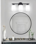 Black 2 Light Vanity Light Over Mirror Wall Sconce With Milky White Frosted Glass Shades in modern bathroom setting.