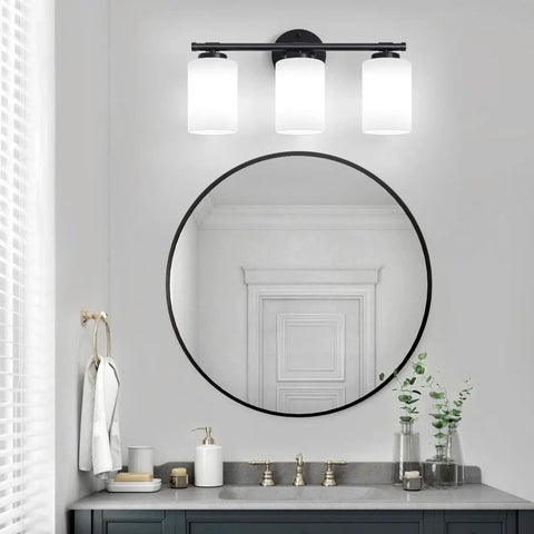 Black 2 Light Vanity Light Over Mirror Wall Sconce With Milky White Frosted Glass Shades in modern bathroom setting.