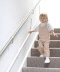 Child using Fully Adjustable Toddler Stair Handrail Built Like A Tank For Little Ones Grows With Your Kid To Deliver Kid Approved Safety And Rock Solid Support Down Each Step Zero Hassle Standard Mount Kit.