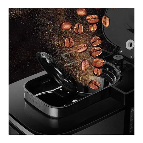 Legit Automatic Drip Coffee Maker With Built In Burr Grinder pouring coffee beans into the grinder compartment.