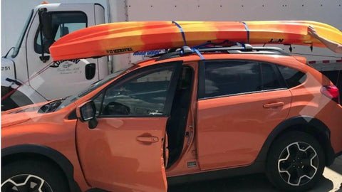 Heavy Duty 6 Pack Ratchet Straps Tie Down Haulers 1 Inch X 12 Foot With S Hooks For Cargo On Trucks Kayaks And Boats securing a kayak on a car roof.