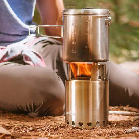 Titan Camping Stove For Backpacking And Outdoor Cooking A Compact Stainless Steel Wood Burning Stove In Use On The Trail