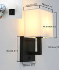 Black Finish Wall Sconce With White Textile Shade, On Off Switch, Sleek Modern Nightstand Lamp For Bedroom And Bedside Reading, E26 Base Compatible, Dimmable With Compatible Bulbs, Bulbs Not Included. Wall mounted with measurements shown.