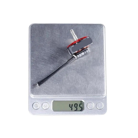 Dope High Performance Brushless FPV Drone Motor With 1300KV on digital scale showing weight, easy install, lightweight