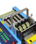 Close-up of Automatic Heat Shrink Tube And Cable Cutting Machine With Programmable Digital Controls, showing cutting mechanism and controls.
