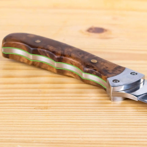 Close-up of a wooden knife handle with visible G10 spacer from the 20 Pcs G10 Spacer Sheets For DIY Knife Making Kit in 10 colors.