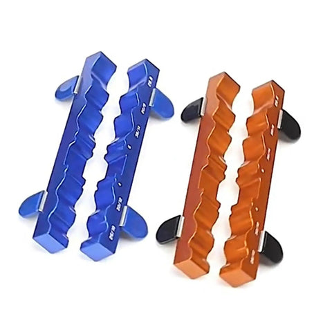 Two sets of anodized aluminum Magnetic Clamp Vise For Bike Parts Adjustable Axle Spindle Holder in orange and blue.